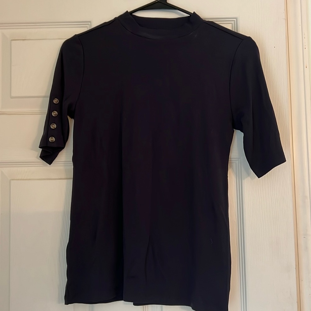 Ann Taylor elbow length tee with button detail.